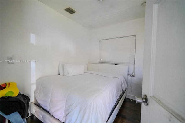 bedroom featuring dark wood-type flooring