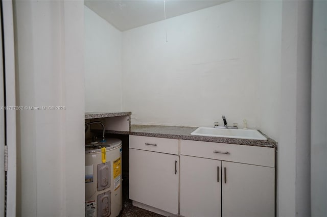 laundry area with sink and water heater