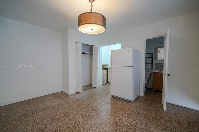 interior space featuring white fridge and a closet