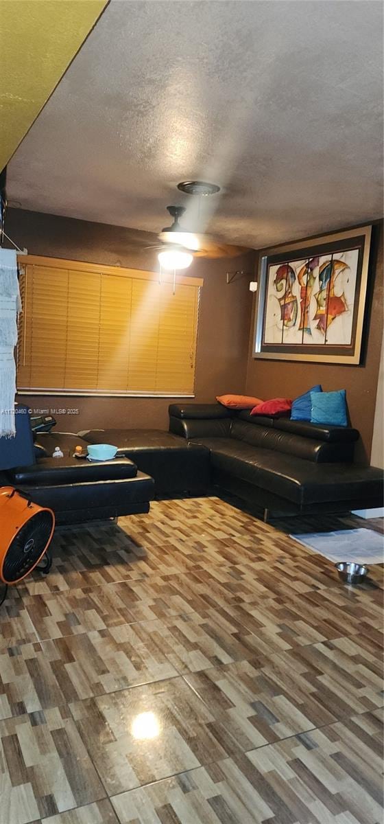 living room featuring a textured ceiling and hardwood / wood-style floors