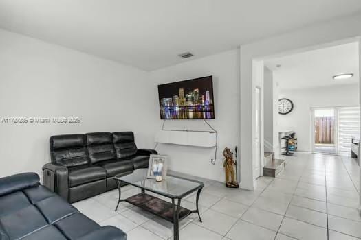 living room featuring light tile patterned flooring