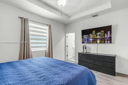 bedroom featuring a tray ceiling