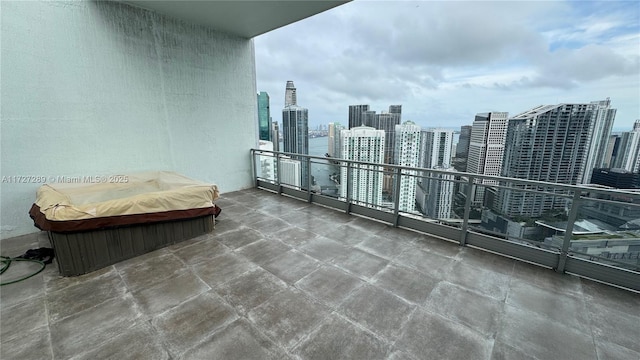 balcony featuring a covered hot tub