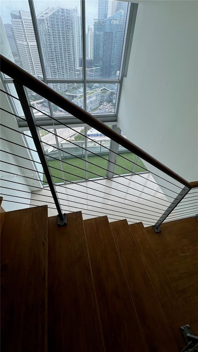 staircase featuring plenty of natural light