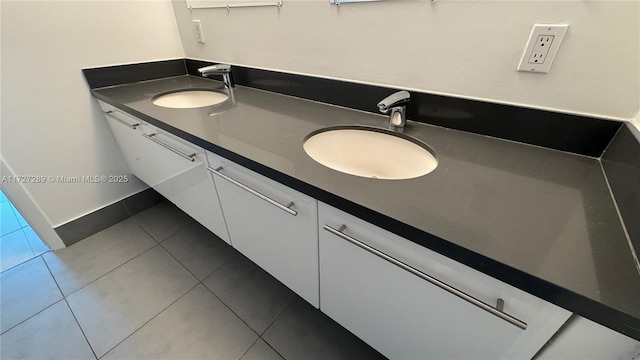 bathroom with tile patterned floors and vanity