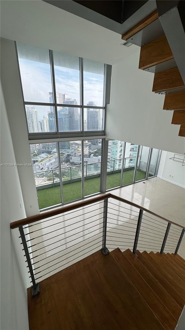 stairs with hardwood / wood-style floors