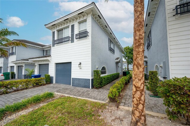 view of side of property with a garage