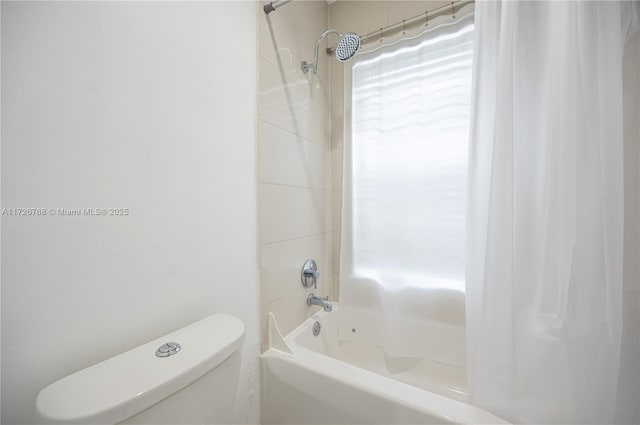 bathroom featuring toilet and shower / bath combination