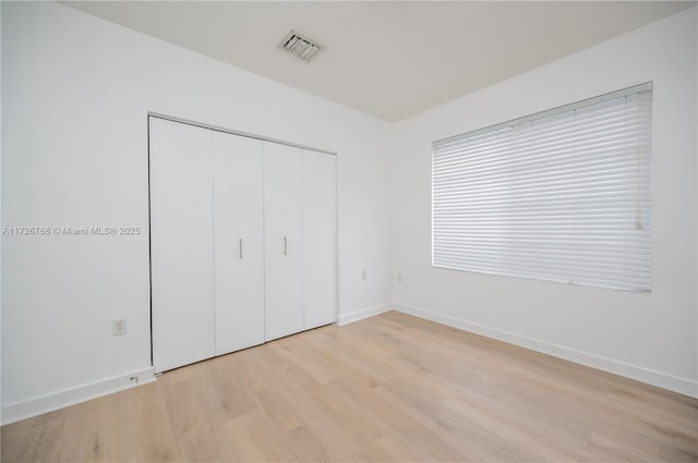 unfurnished bedroom featuring light hardwood / wood-style flooring