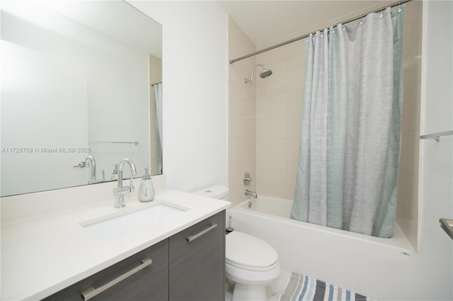 full bathroom with shower / bath combo with shower curtain, toilet, and vanity