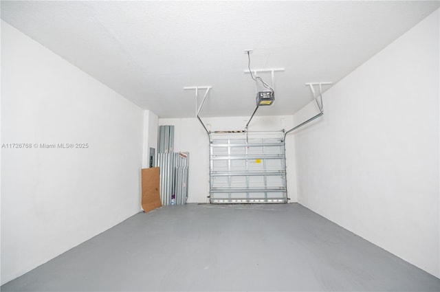 garage featuring a garage door opener and electric panel