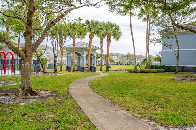 view of property's community with a playground and a lawn