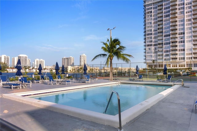 view of swimming pool with a patio