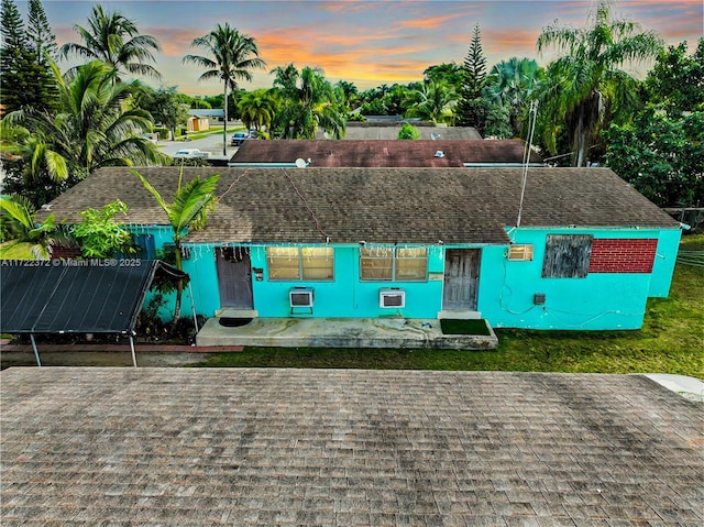 view of front of property with solar panels