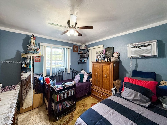 bedroom with ceiling fan and a wall mounted AC