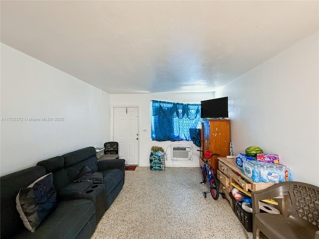 living room featuring an AC wall unit