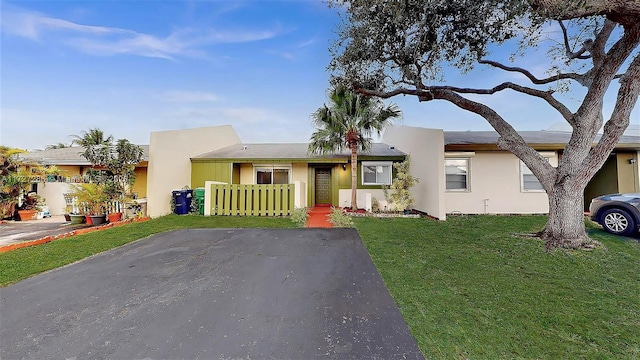 view of front of property with a front lawn