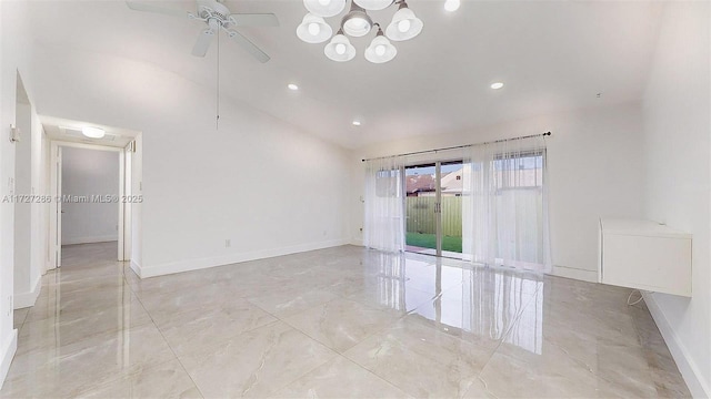 empty room featuring ceiling fan and lofted ceiling