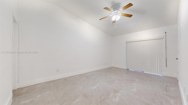 interior space featuring ceiling fan and vaulted ceiling