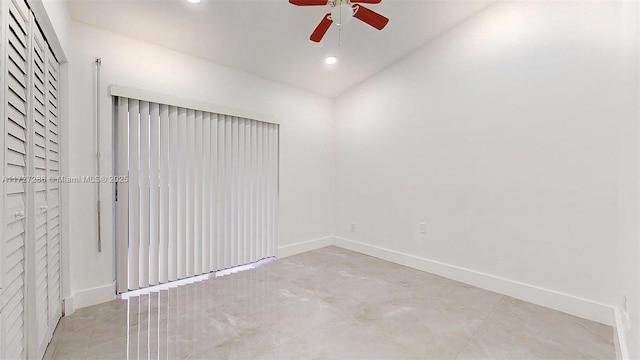 unfurnished room featuring vaulted ceiling and ceiling fan