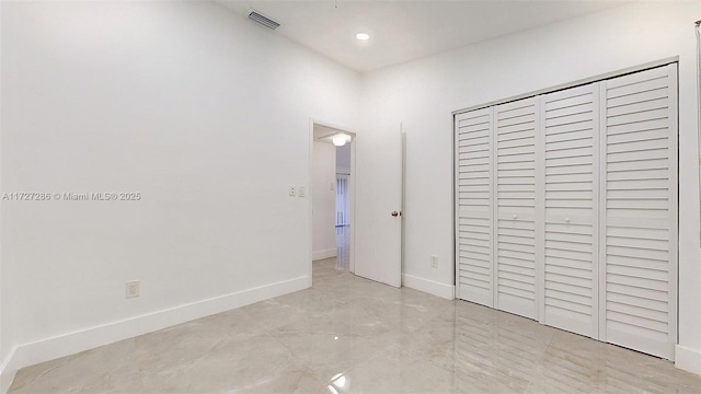 unfurnished bedroom featuring a closet