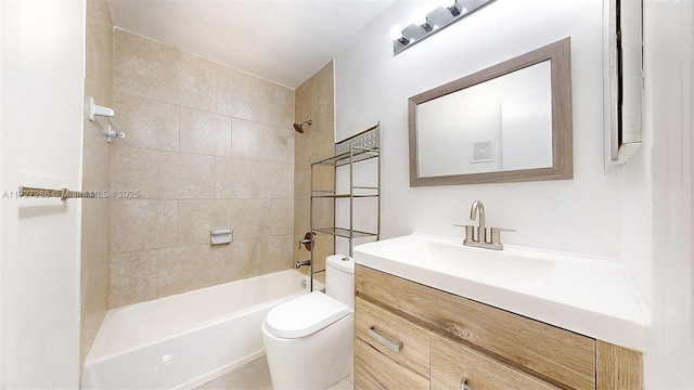 full bathroom featuring toilet, tiled shower / bath, and vanity