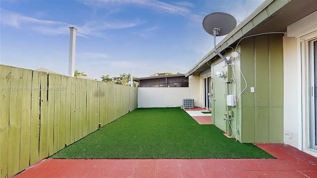 view of yard with central AC unit