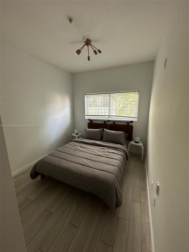 bedroom with wood-type flooring