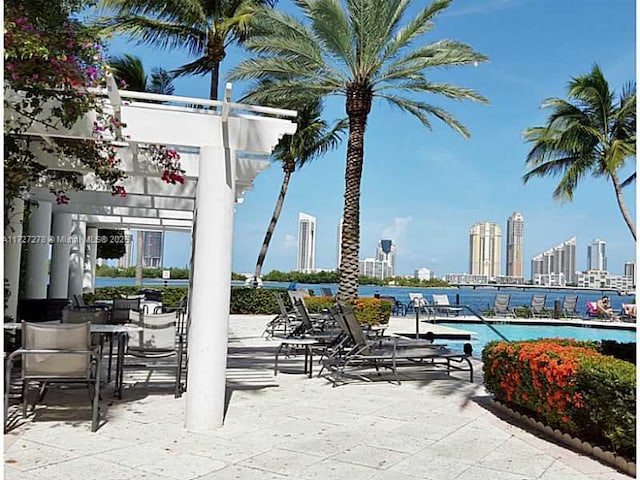 view of patio featuring a community pool