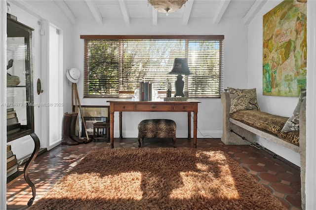 unfurnished room featuring beam ceiling and wooden ceiling