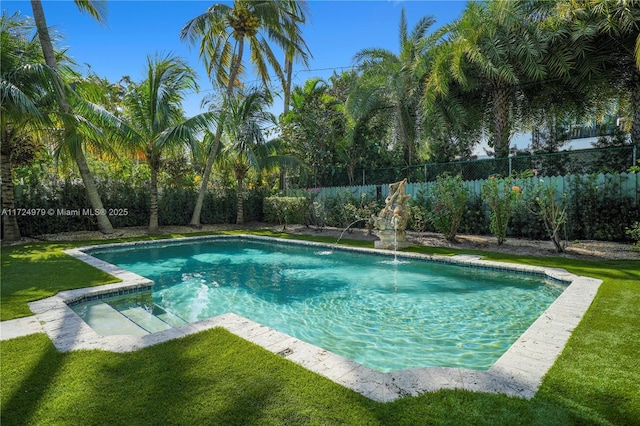 view of swimming pool featuring a yard and pool water feature