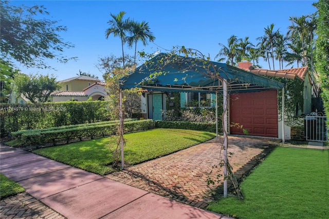 view of front of property with a garage, a front yard, and central air condition unit