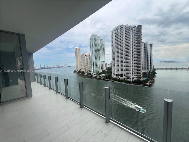 balcony featuring a water view