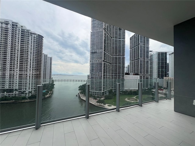 balcony featuring a water view