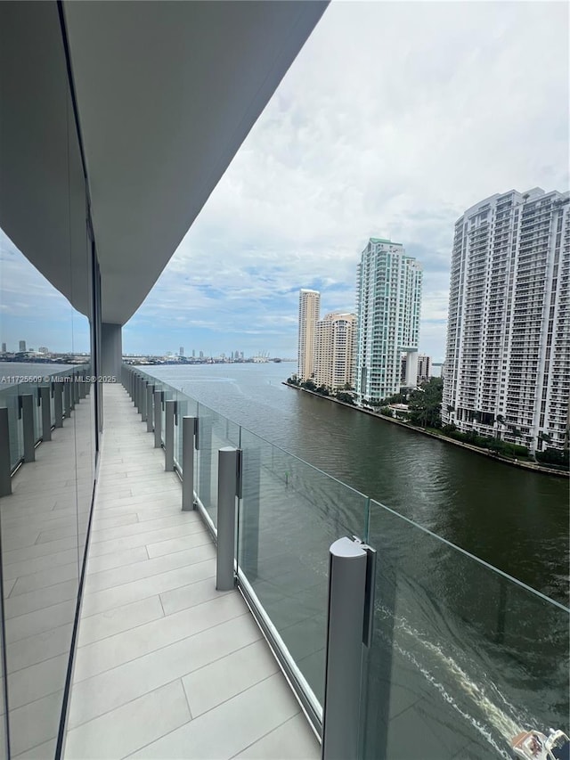 balcony featuring a water view