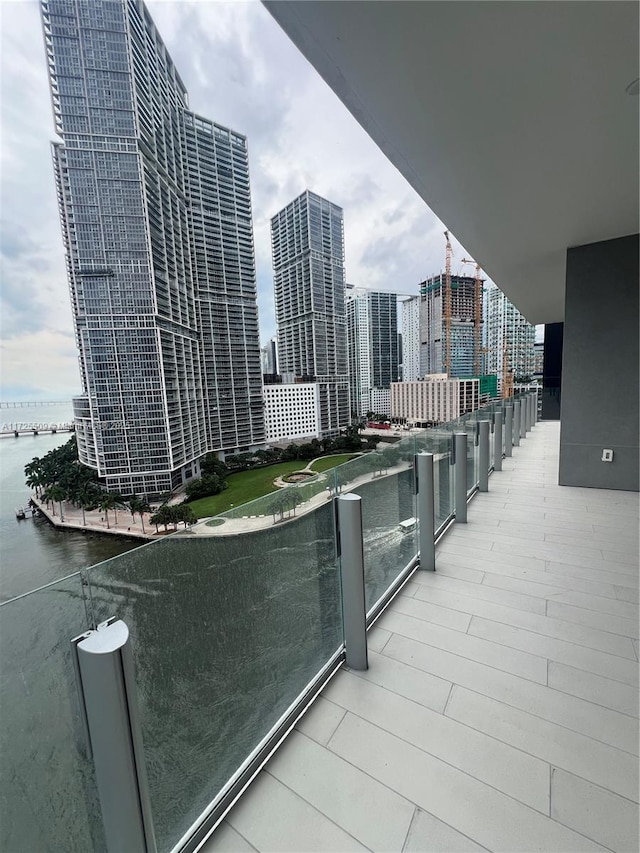 balcony featuring a water view