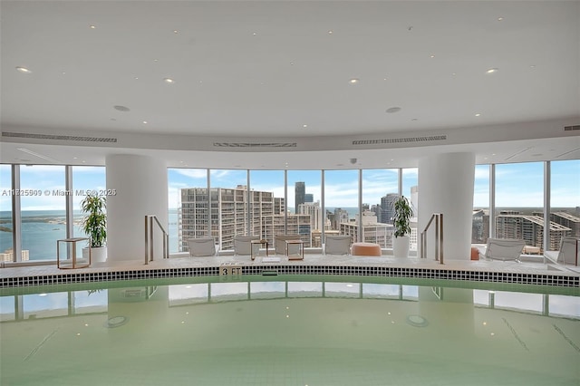 view of swimming pool featuring a city view