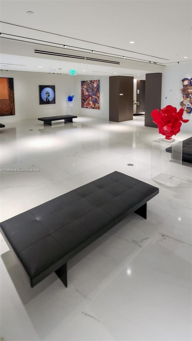 interior space featuring marble finish floor