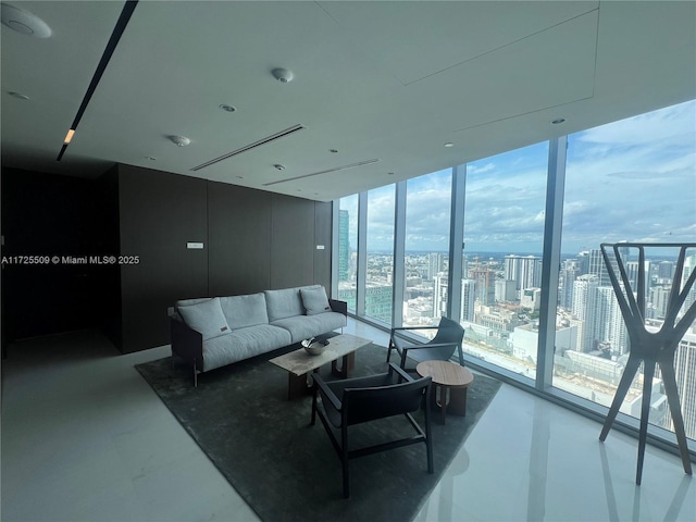 living room featuring a wall of windows and a wealth of natural light