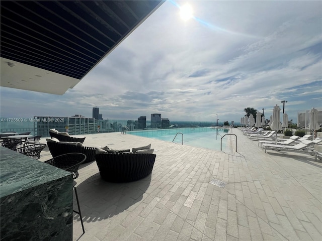 view of swimming pool with a patio