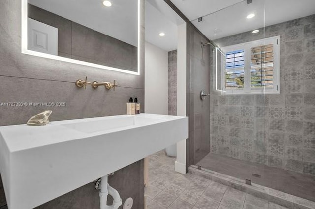 bathroom with a tile shower