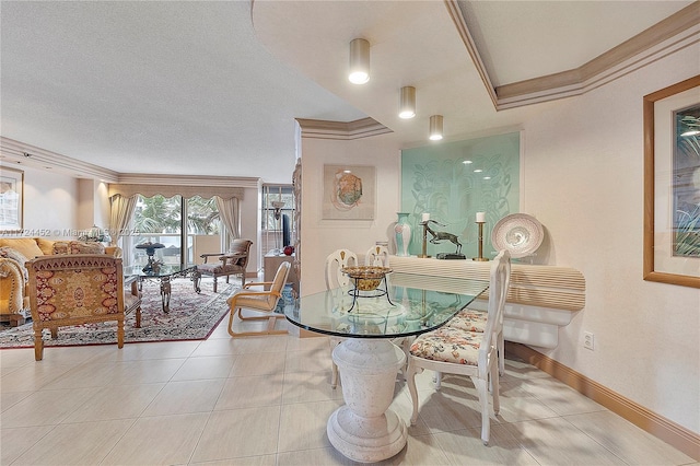 dining space with light tile patterned floors and ornamental molding