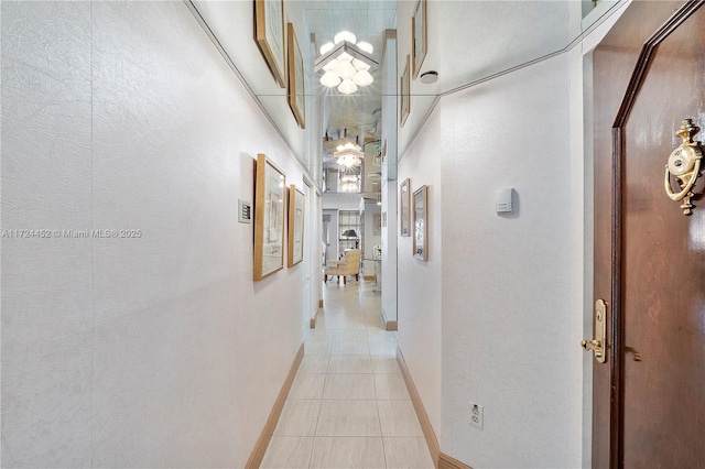 corridor with light tile patterned floors