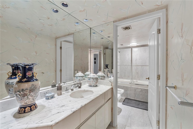 bathroom with enclosed tub / shower combo and vanity