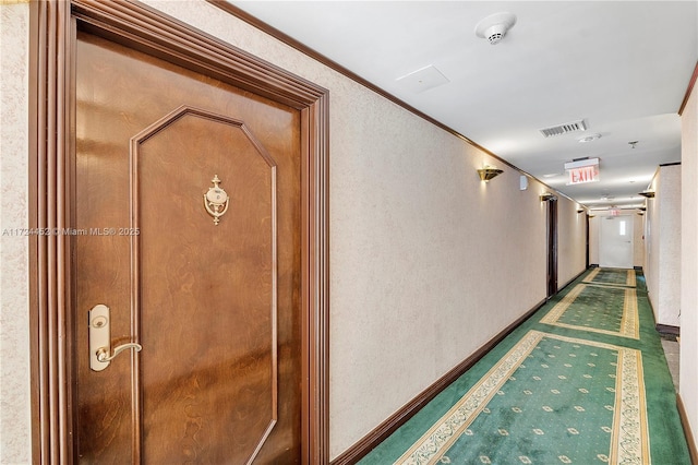 corridor featuring crown molding