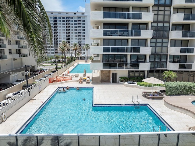 view of swimming pool featuring a patio