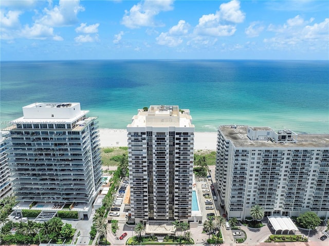 bird's eye view with a water view and a view of the beach