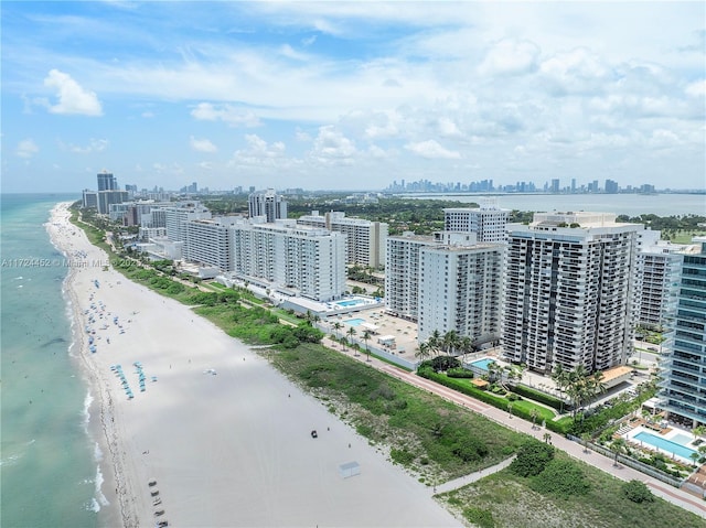 bird's eye view featuring a view of the beach and a water view