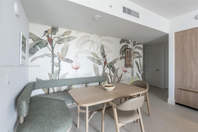 dining area with light tile patterned flooring