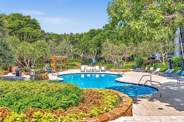 view of swimming pool featuring a pergola and a patio area